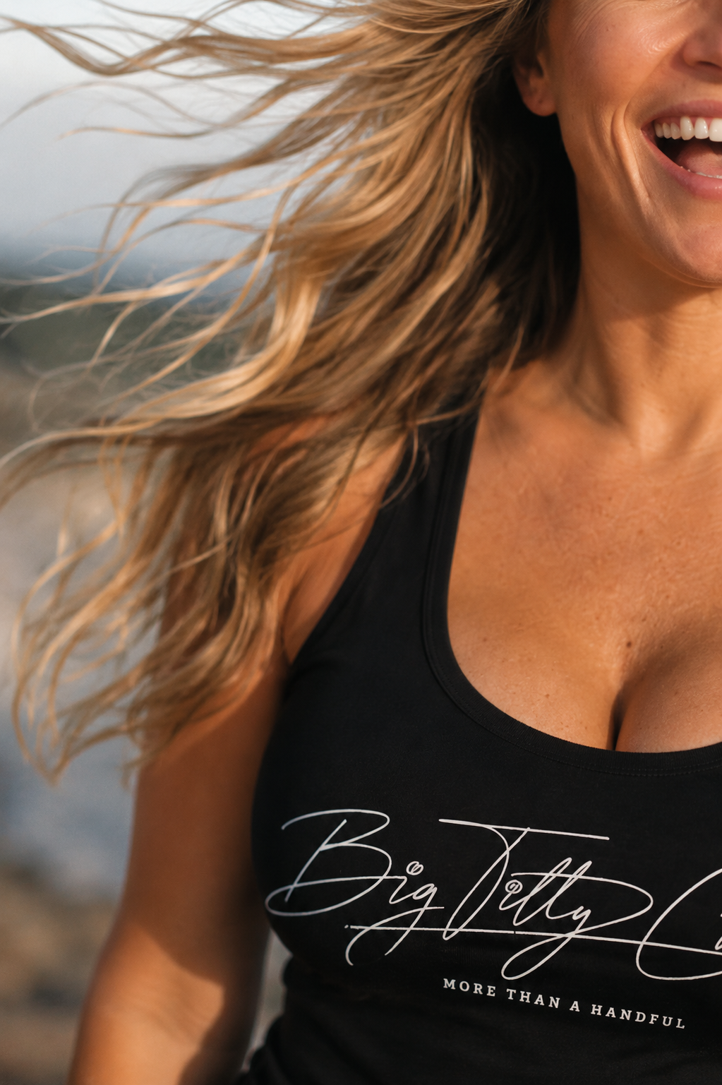 Woman laughing in a Big Titty Committee tank