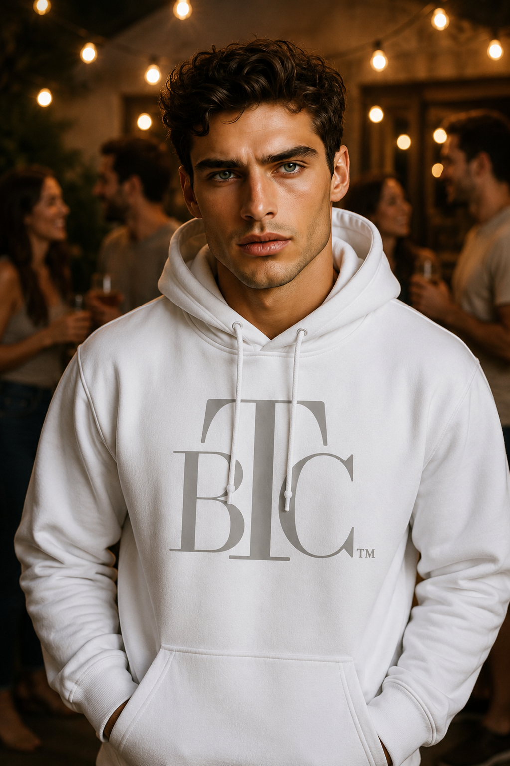 Man in white BTC hoodie at night
